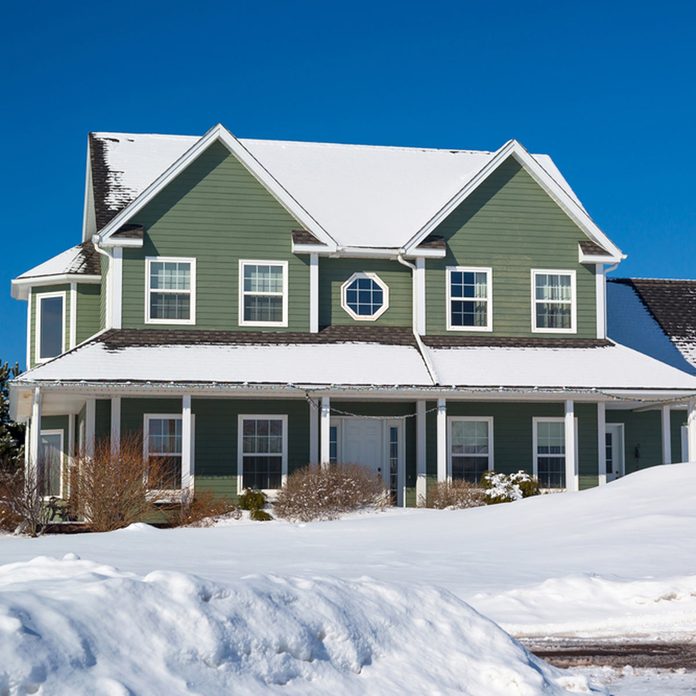 shutterstock_299270855-1200x1200 home covered in snow winter house