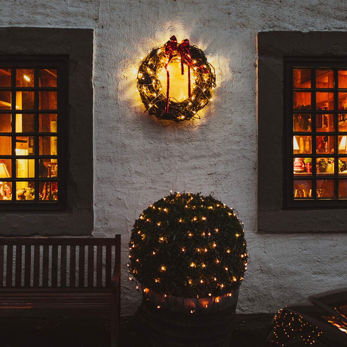 shutterstock_524099515-1200x1200 exterior of home during christmas time wreath christmas lights