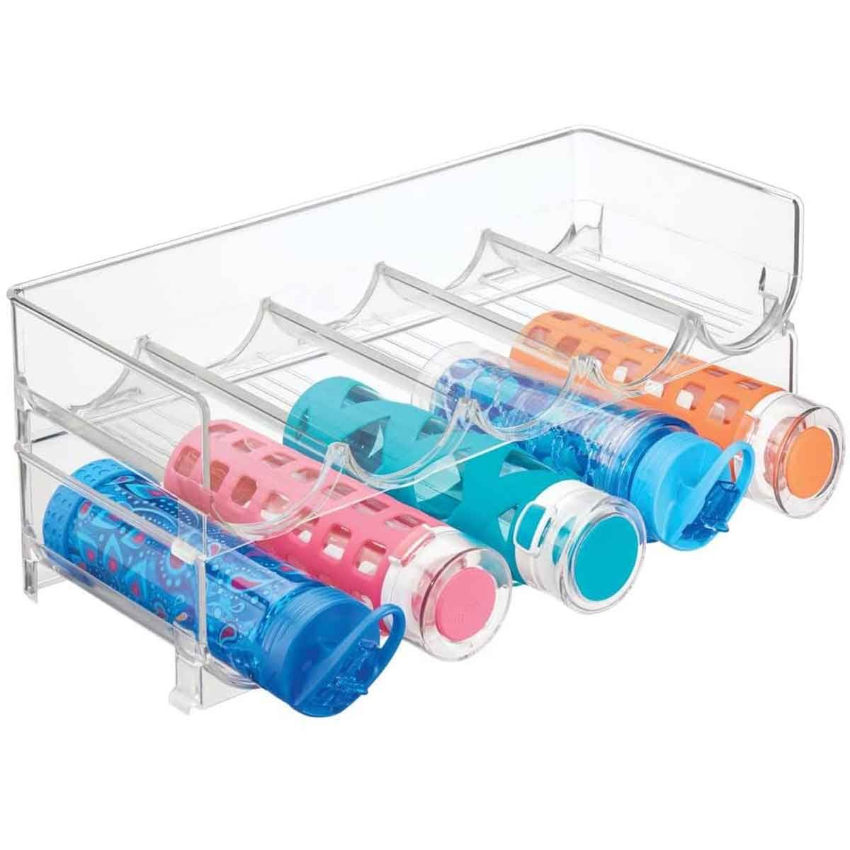 A clear plastic organizer holds four colorful, patterned water bottles, each positioned in separate compartments, displaying various vibrant colors.