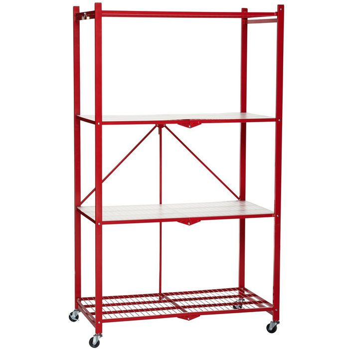 A red metal shelving unit displays three shelves, providing storage space. It's on wheels, facilitating movement, likely intended for a kitchen or storage area.