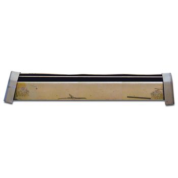 A rectangular metal object with scuff marks rests horizontally, featuring two end caps, likely part of a larger mechanism or structure in a plain background.