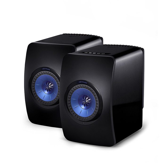Two sleek black wireless speakers sit side by side, featuring circular blue-lit speaker cones, designed to enhance audio quality in a modern setting.