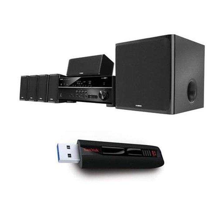 A black home audio system with multiple speakers plays music, while a SanDisk USB drive sits below, suggesting connectivity for media playback.