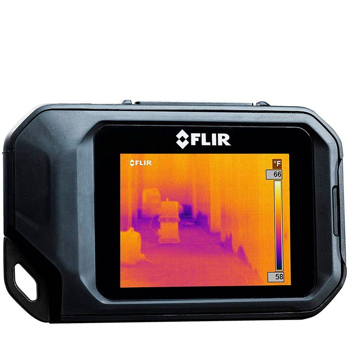 A thermal imaging camera displays a gradient of temperatures in a corridor, highlighting objects with varying heat signatures, indicating a range of 58°F to 66°F.