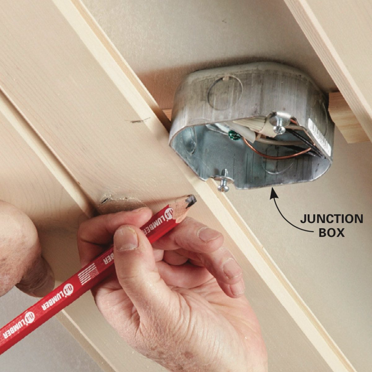 Hold the board in place next to the box and mark the sides.