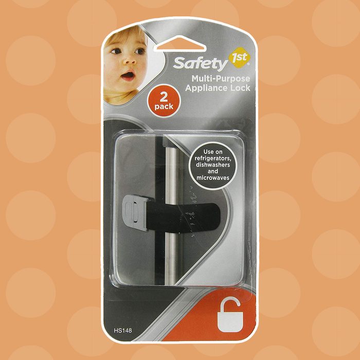 A black multi-purpose appliance lock is displayed on packaging, designed for securing refrigerators, dishwashers, and microwaves, with a child's face visible in the corner.