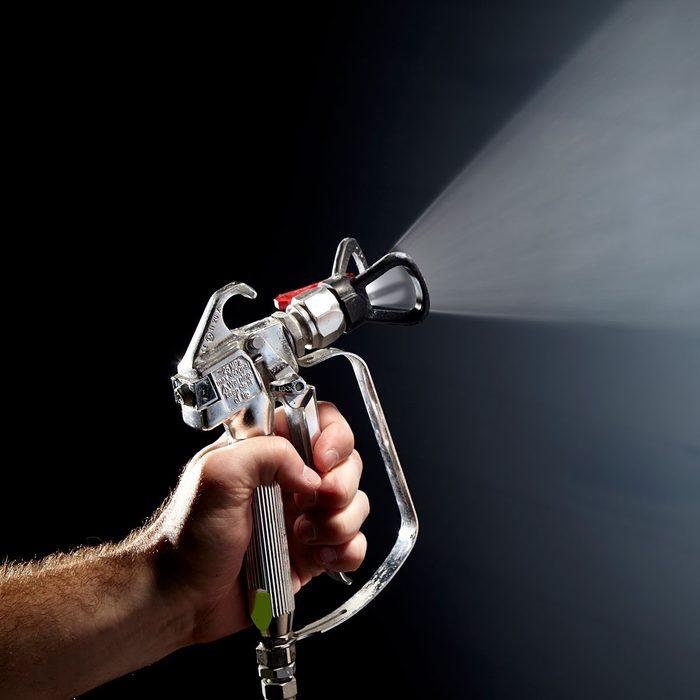 spraying paint out of an exterior spray painter | Construction Pro Tips