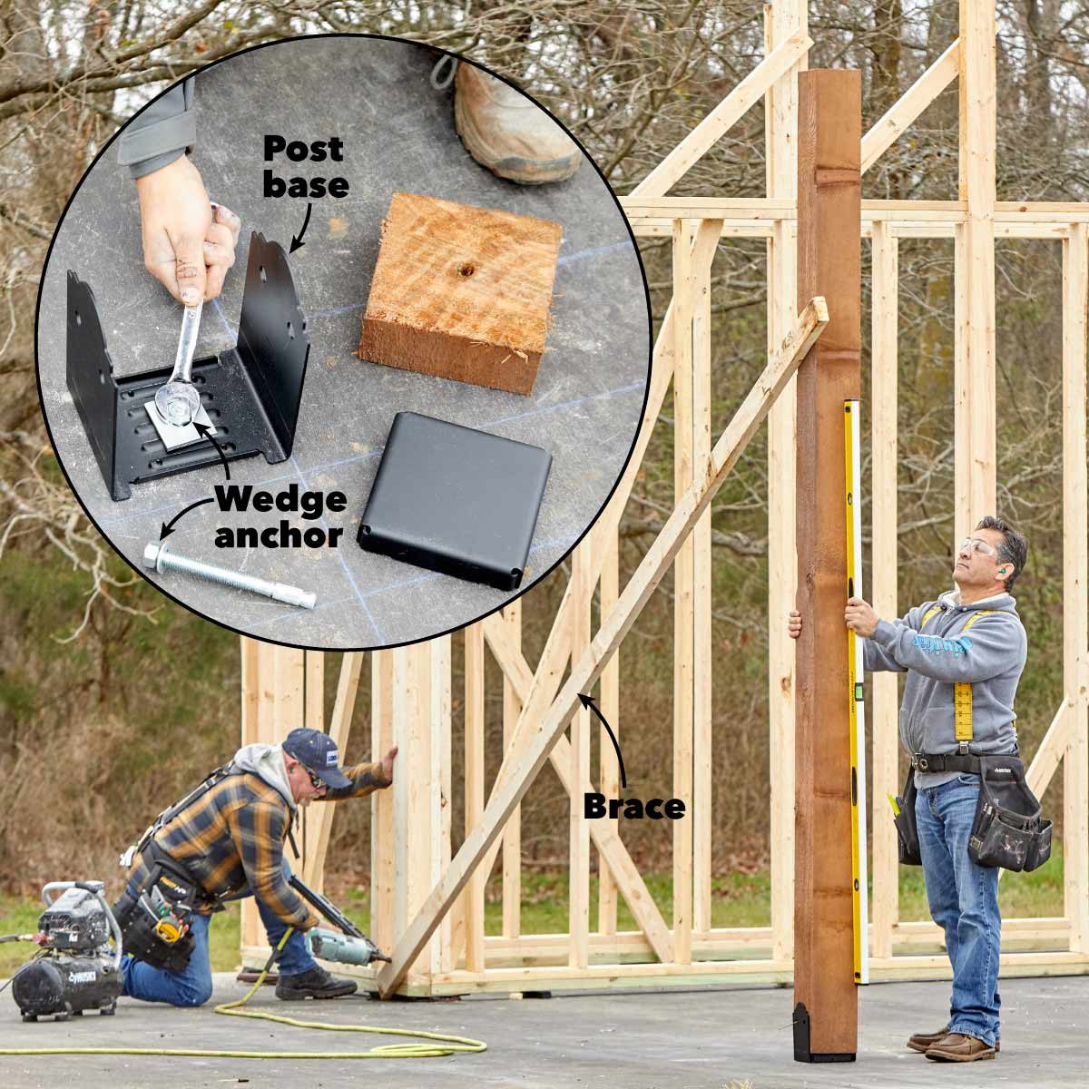 A construction worker raises a wooden post, using a level for accuracy, while another worker secures framework elements on a building site.