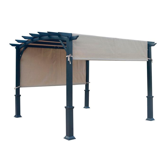 A metal pergola stands with a fabric canopy attached, providing shade. It is set against a plain, light background, emphasizing its structure and function.