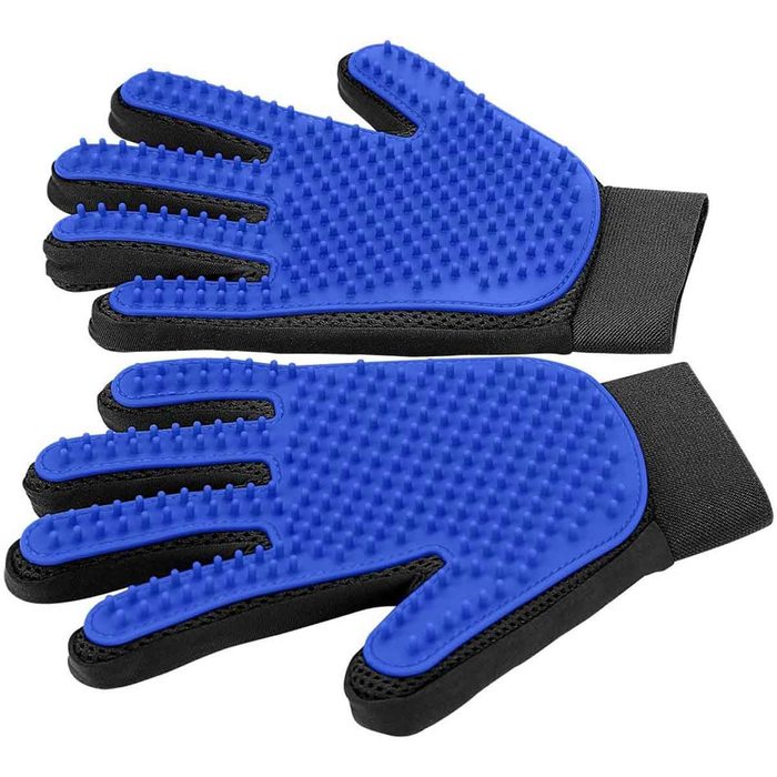 Blue silicone cooking gloves with textured surfaces rest side by side, designed for heat resistance and grip, suitable for handling hot dishes or grilling.