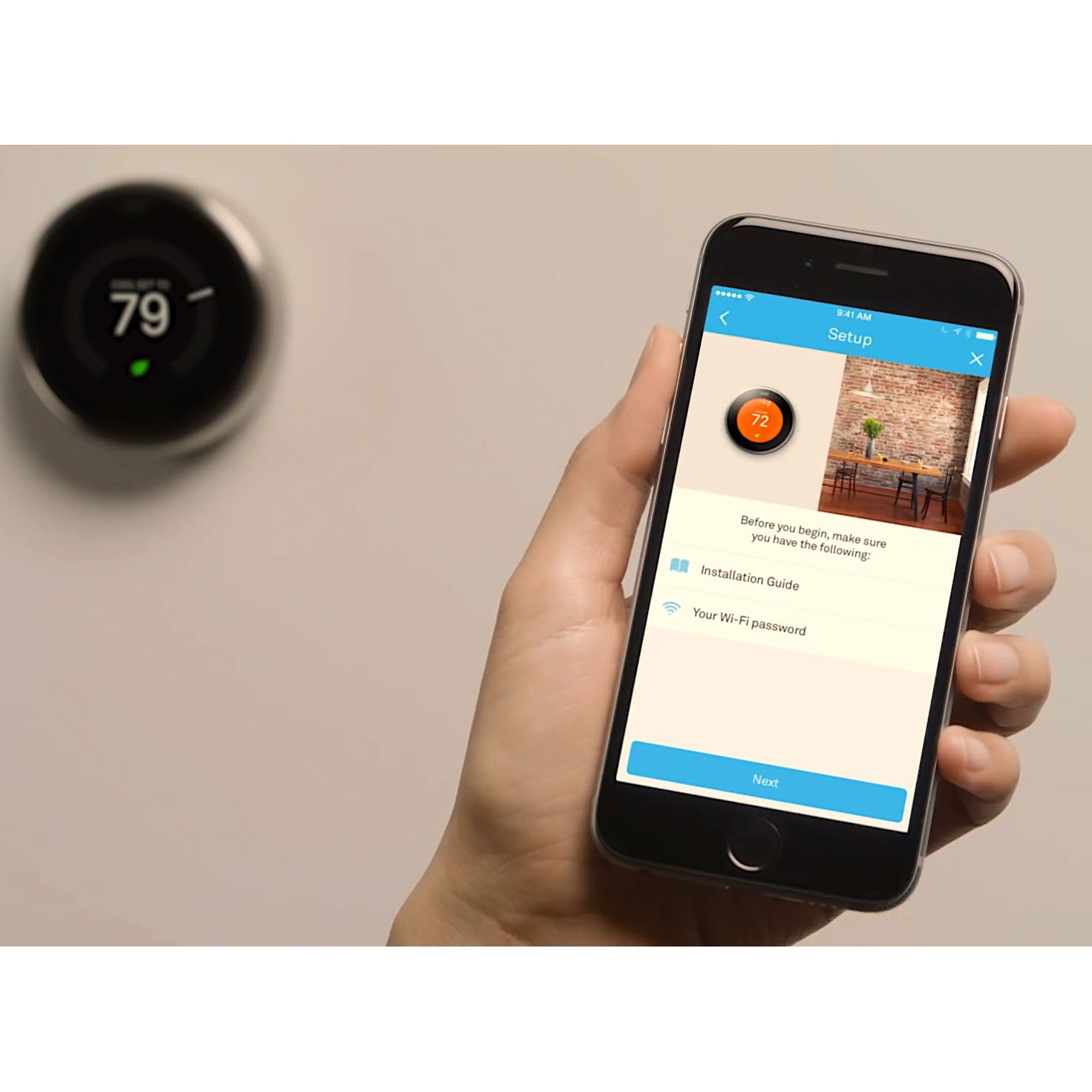 A smartphone displays a setup screen for a thermostat, showing a temperature of 72°F, while the thermostat on the wall shows a reading of 79°F.