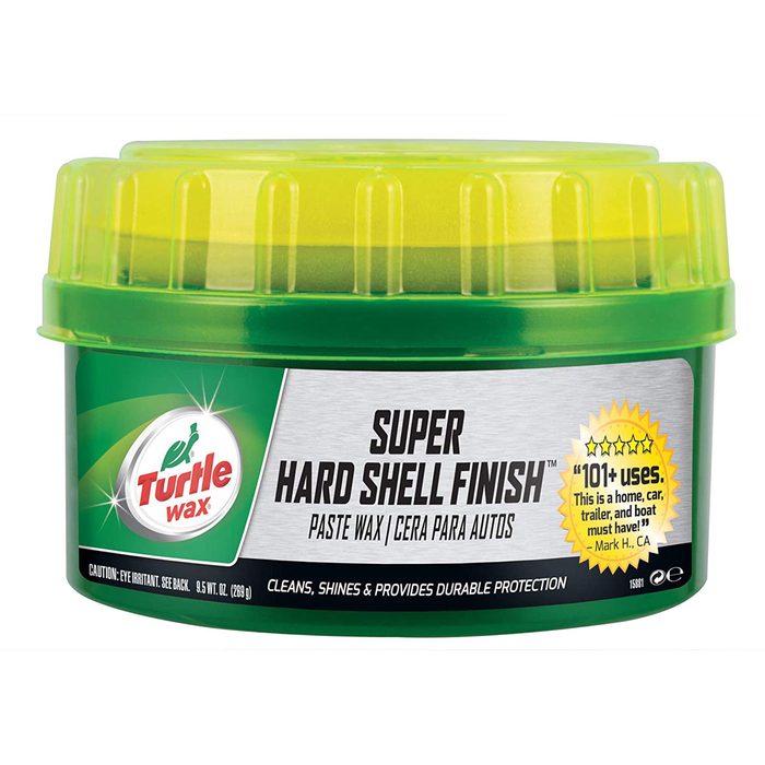 A green container of Turtle Wax holds paste wax labeled 