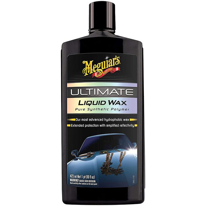 A black bottle of Meguiar's Ultimate Liquid Wax displays its product label, highlighting features like hydrophobic properties and reflectivity, with a car image on the packaging.