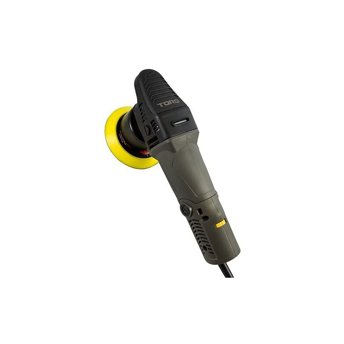 A circular polisher is positioned upright, featuring a yellow pad and a textured grip, typically used for polishing surfaces in a workshop or garage setting.