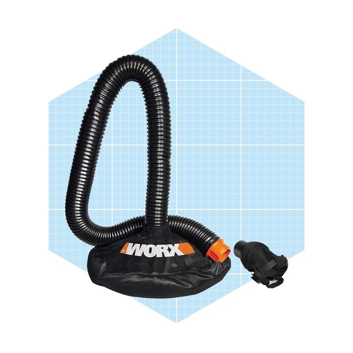A black garden vacuum accessory with a flexible hose is positioned upright on a blue grid background, designed for collecting debris and leaves.