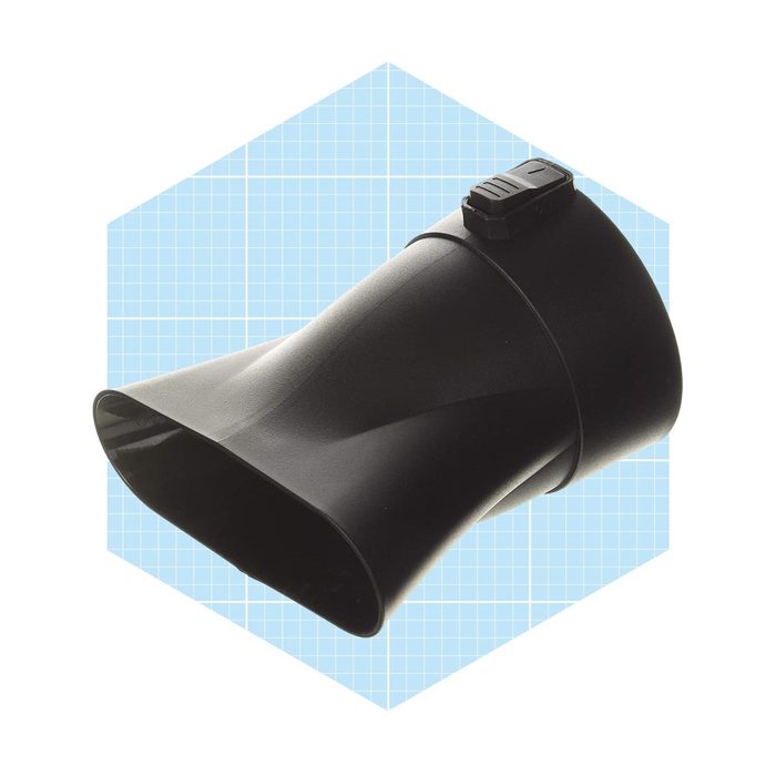 A black plastic funnel lies flat, with a switch on the side, set against a light blue, grid-patterned background.