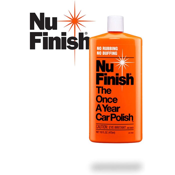 A bright orange bottle of car polish is displayed prominently, stating it's a once-a-year treatment with warnings about eye irritation. Stars and brand name are featured above.