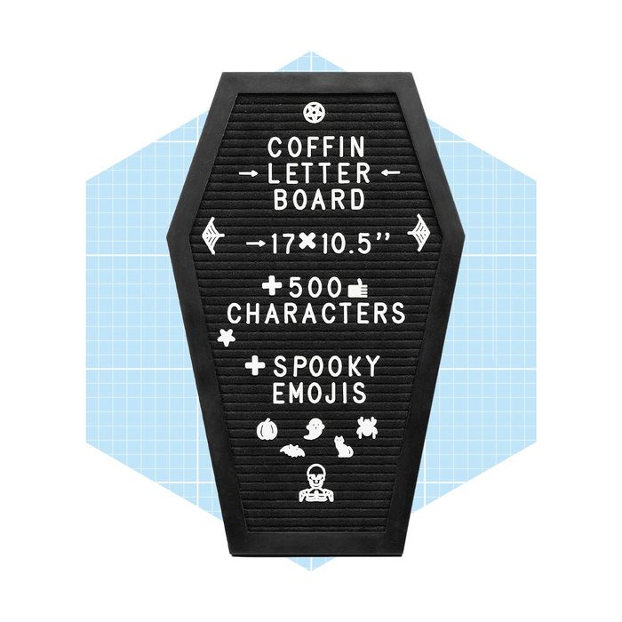 A coffin-shaped letter board displays text and spooky emojis, allowing customization for messages in a playful, Halloween-themed context.