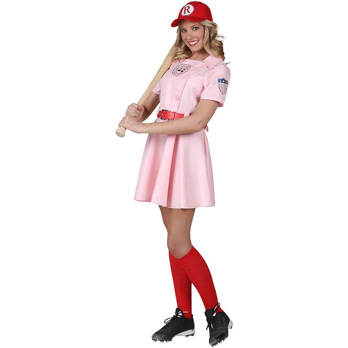 A woman stands holding a baseball bat, wearing a pink dress and red accessories, in a playful sports-themed pose.