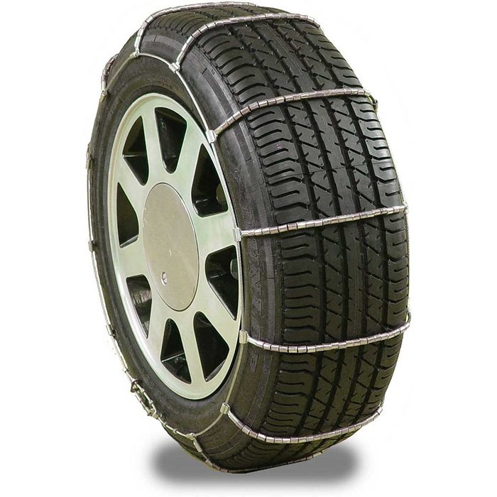 A tire fitted with metal chains is displayed, designed to enhance traction on slippery surfaces, emphasizing winter driving safety and preparedness.