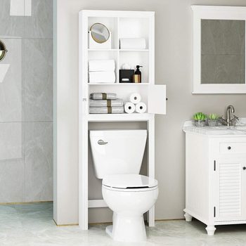 A white bathroom cabinet with shelves full of towels and toiletries stands above a white toilet, adjacent to a marble-top sink and a mirror.