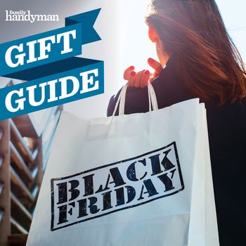 A woman holds a shopping bag labeled "BLACK FRIDAY" while walking outdoors, illuminated by sunlight and surrounded by a blurred urban environment.