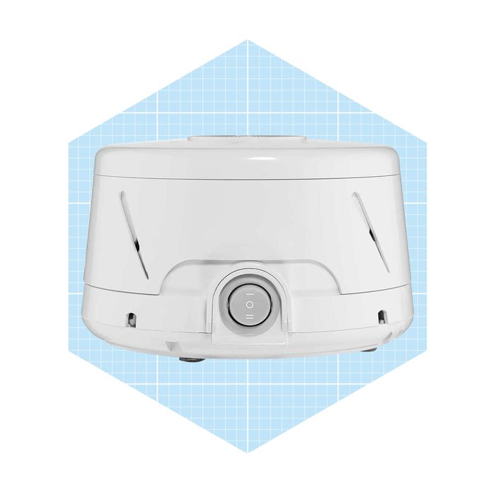 A white device sits centrally, featuring a power button, against a light blue grid background. It appears designed for small household tasks.