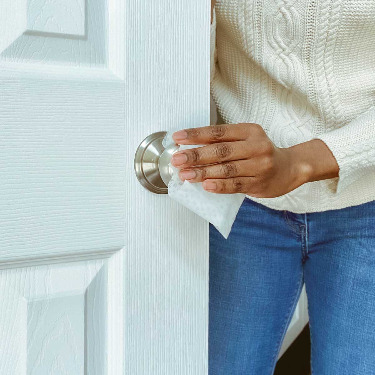 Cleaning Door Knob Gettyimages 1211844309