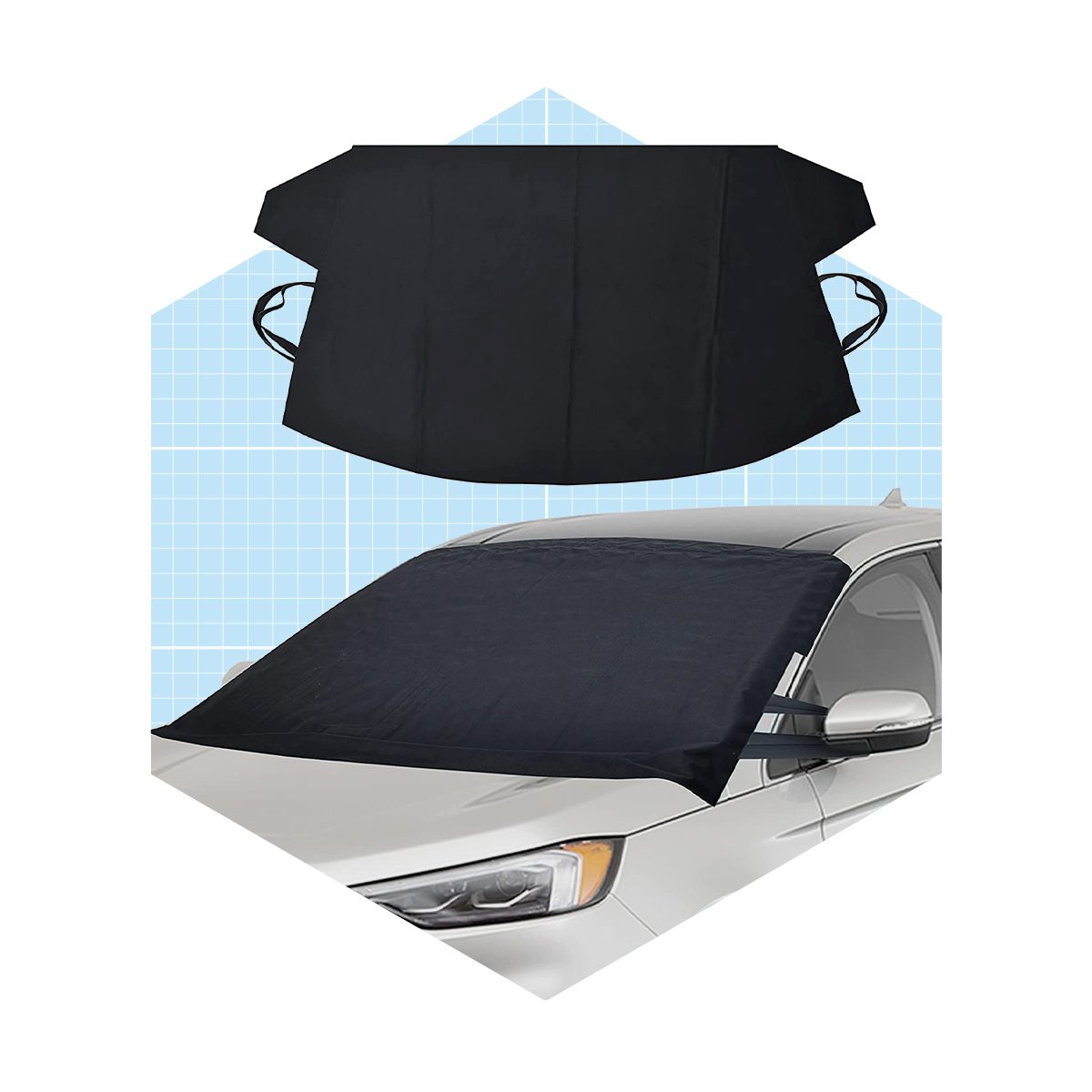 A black sunshade is placed over a car windshield, protecting it from sunlight, against a light blue background with a grid pattern.