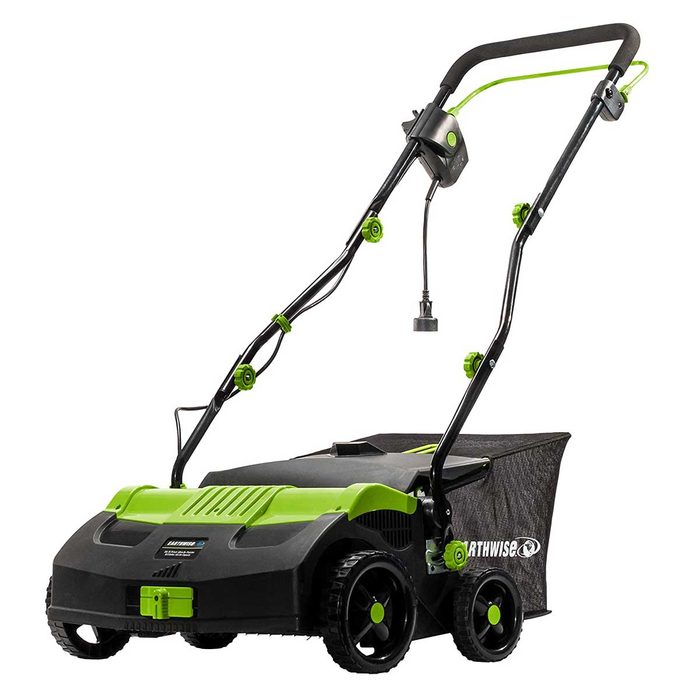 A lawn mower with a green and black design is positioned upright, ready to operate, in a likely outdoor garden environment.
