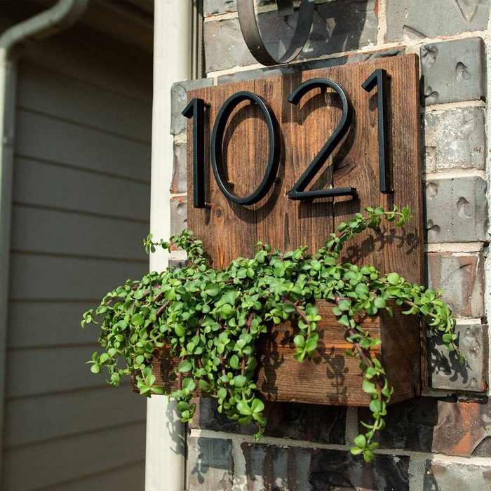 A wooden sign with the number 
