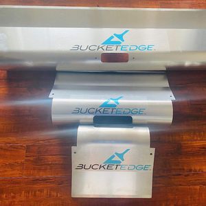A series of metallic panels with the logo 
