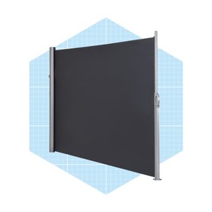 A vertical gray fabric screen stands on a shiny metal frame against a light blue geometric background, providing a partition in an open space.