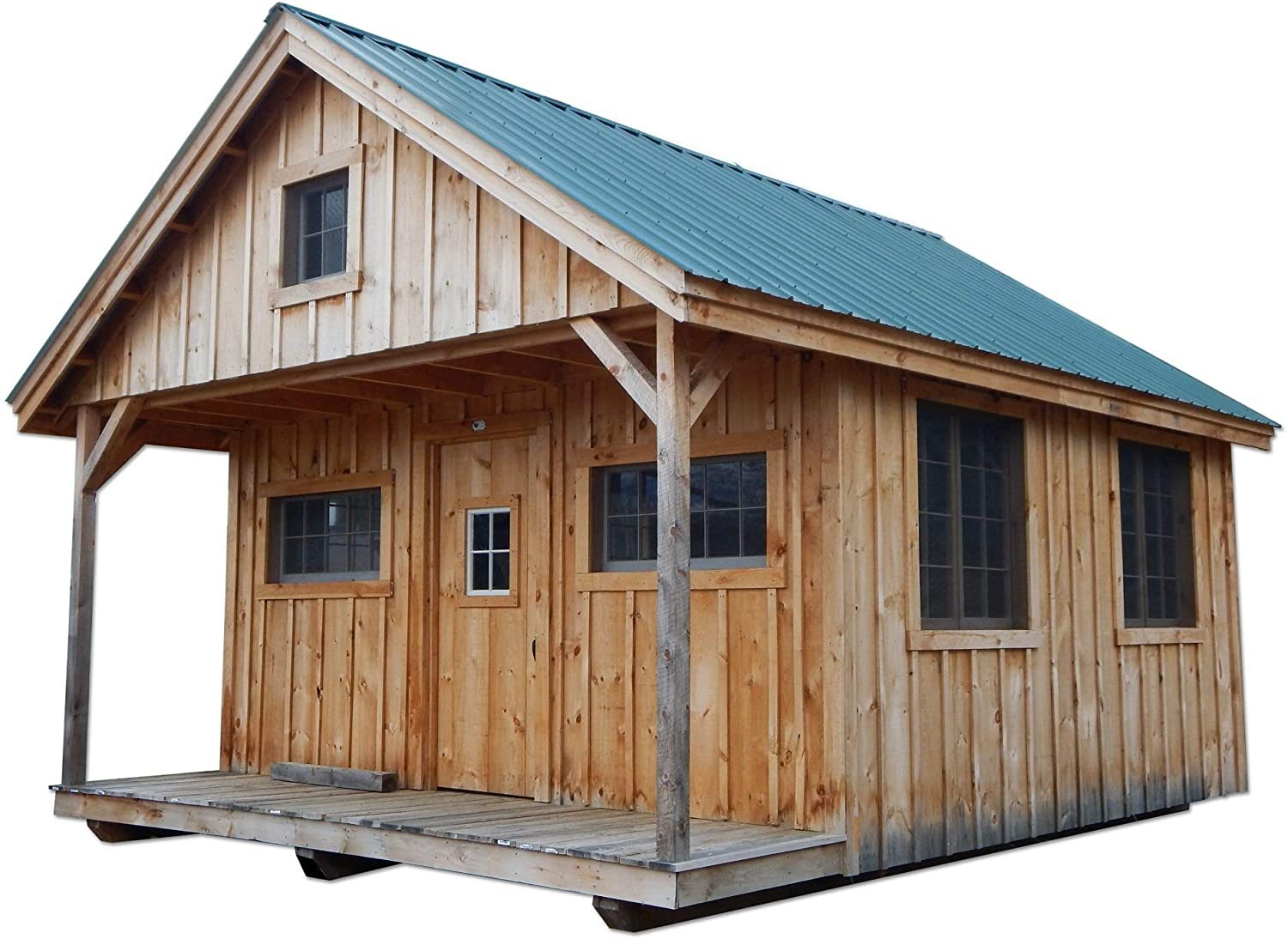 A wooden cabin stands on a platform, showcasing a slanted green metal roof, front porch, and multiple windows, suggesting a rustic, outdoor setting.