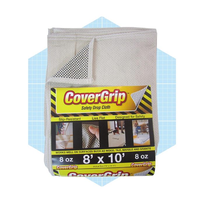 A safety drop cloth lies flat, designed for slip resistance. It's marked as 8’ x 10’ and is suitable for various surfaces like wood and tile.