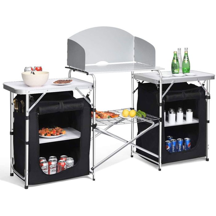 A folding kitchen station displays food and beverages on two surfaces, with storage compartments below, set against a plain background.