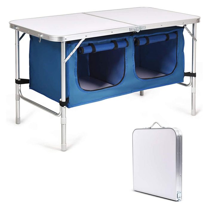 A folding table with a white top and blue fabric compartments underneath is shown, alongside a compact version folded for storage.