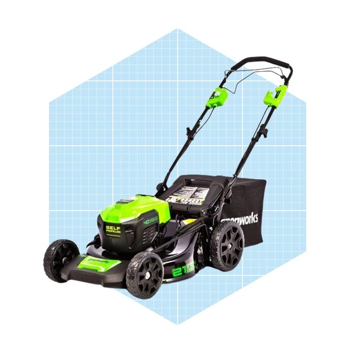 A self-propelled lawn mower with a green top and black wheels sits against a light blue grid background, designed for efficient grass cutting.
