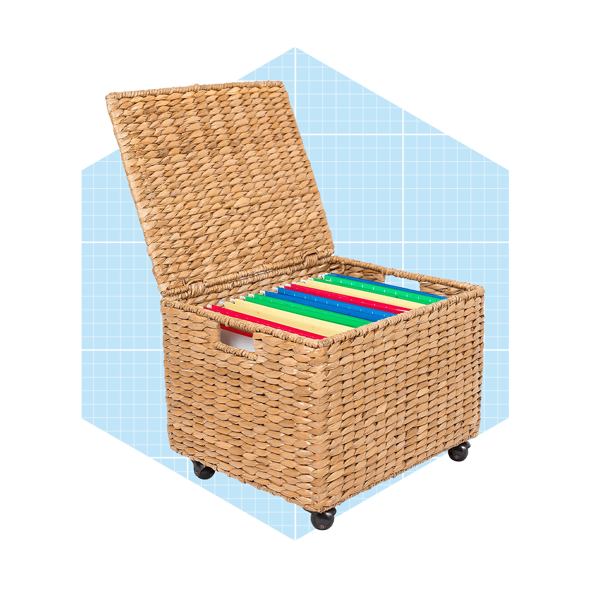 A woven storage box with an open lid contains colored items, placed on wheels against a light blue geometric background.