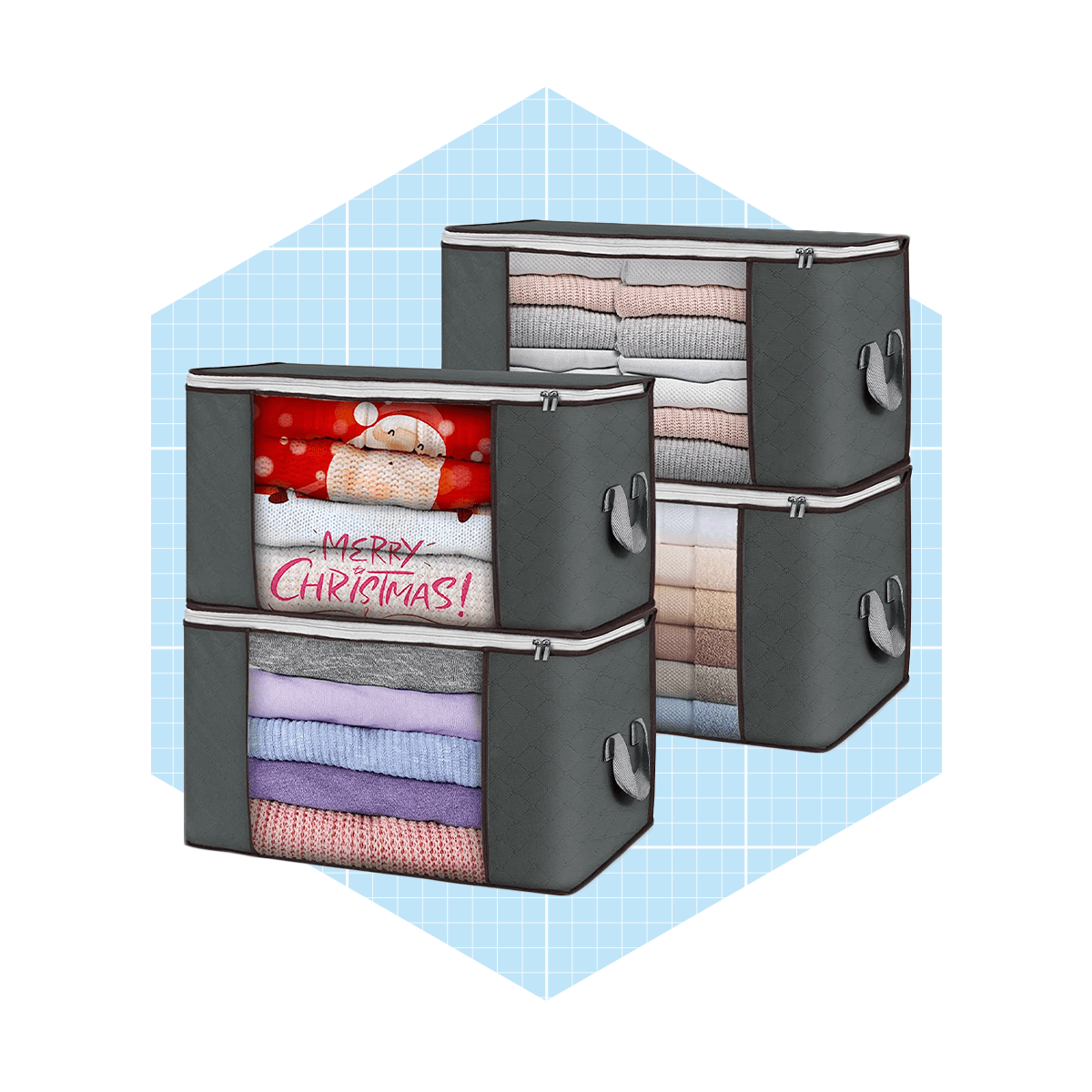 Four storage bags neatly contain folded clothes, featuring a festive "MERRY CHRISTMAS!" message on one. They are placed against a light blue grid background.