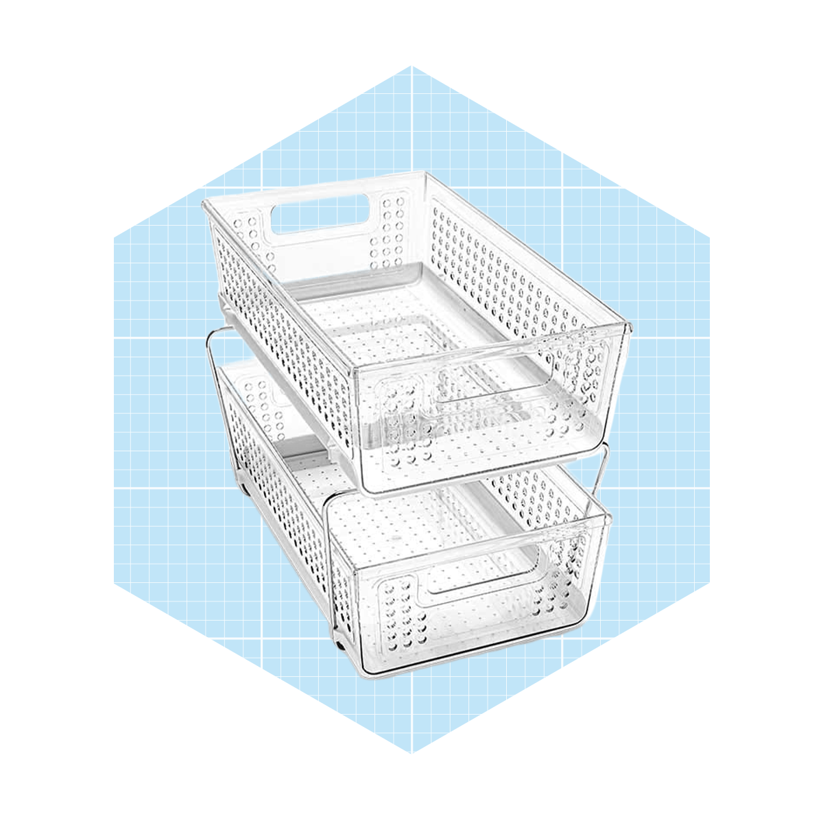 A stack of transparent plastic baskets sits on a blue, grid-patterned background, showcasing their perforated design and handles for easy carrying.