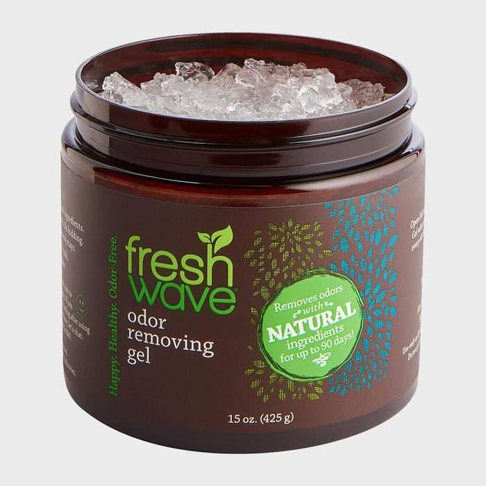 A round, dark brown jar contains a translucent gel designed to remove odors, situated against a neutral background.