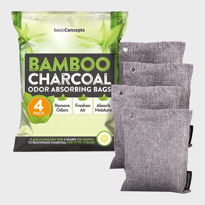 Bamboo charcoal odor-absorbing bags rest beside a colorful packaging, emphasizing their purpose to remove odors, freshen air, and absorb moisture.