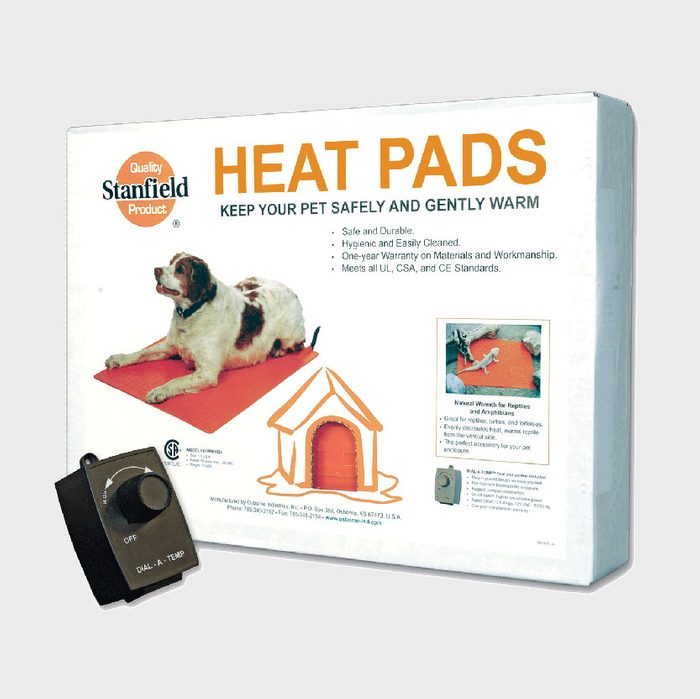 A heat pad for pets is shown, with a dog resting on it. The product packaging displays warmth and safety instructions for pet care.