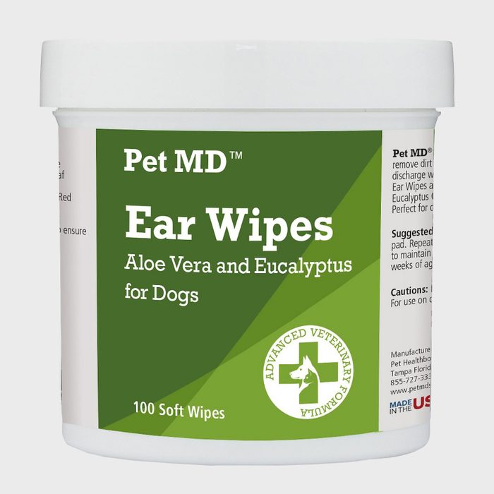 A container of ear wipes designed for dogs, labeled with ingredients and instructions, sits against a plain background, indicating veterinary use and care for pets.