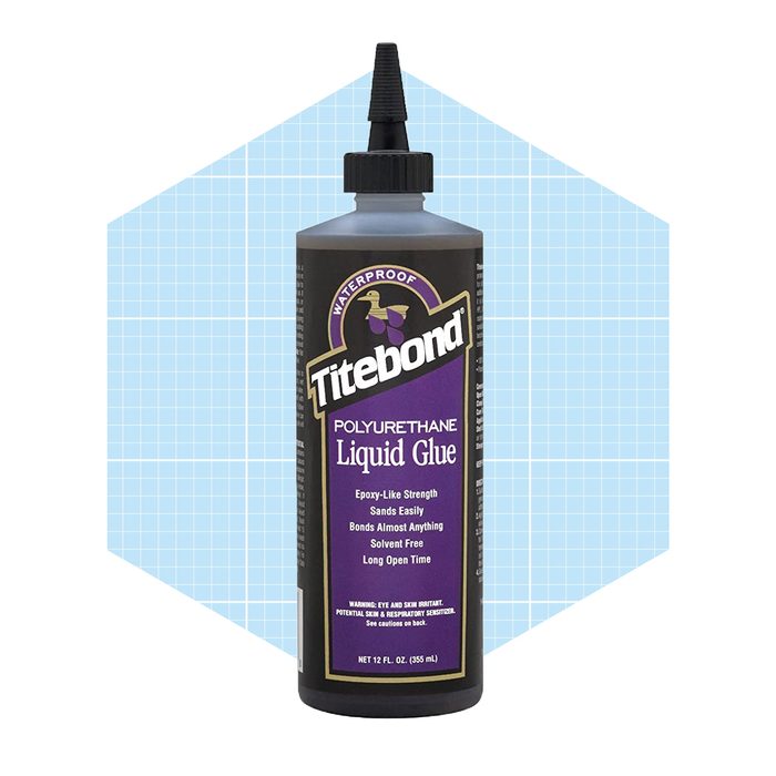 A bottle of Titebond polyurethane liquid glue stands upright. It features a black body with purple labeling, set against a blue grid background.