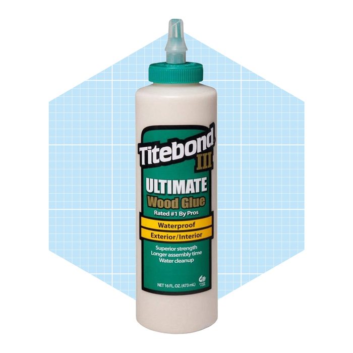 A bottle of Titebond III Ultimate Wood Glue is standing upright, with a green cap and label. The background features a light blue grid pattern.