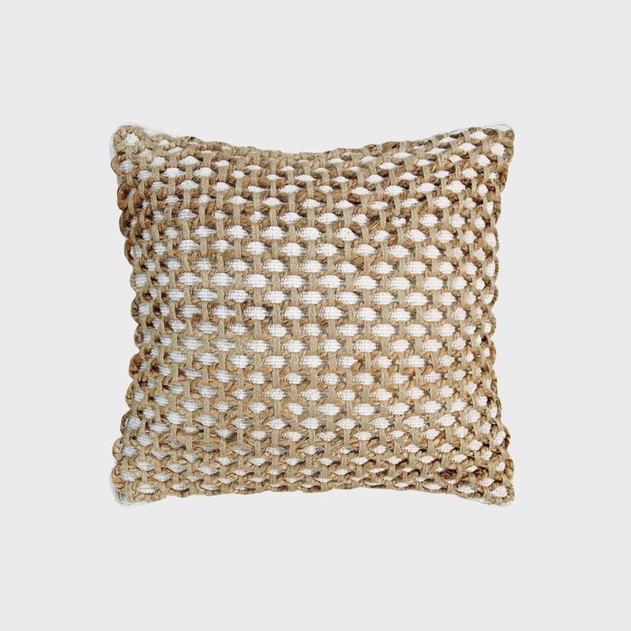 A textured throw pillow rests against a plain background, showcasing a woven design in shades of brown and cream, enhancing its decorative appeal.
