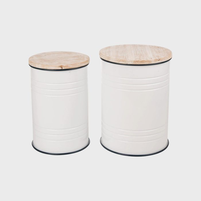 Two cylindrical white storage containers with wooden lids rest side by side on a plain background. They vary in height and diameter.