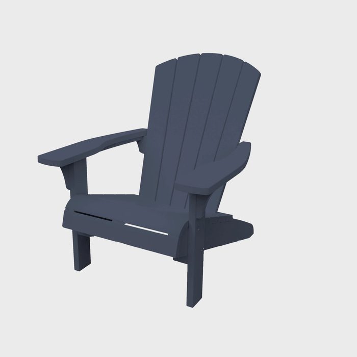 A dark blue Adirondack chair sits upright, designed for relaxation, with wide armrests and a slatted back, set against a plain white background.